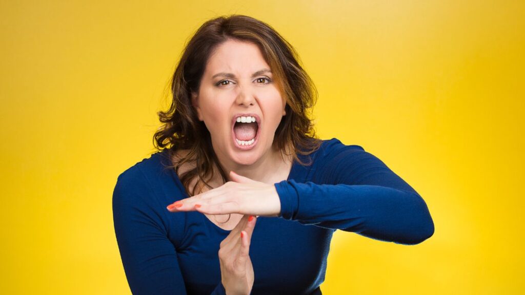 Time out - woman gesturing time out with her hands yelling