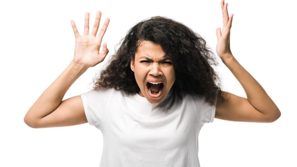 angry woman yelling with her hands up