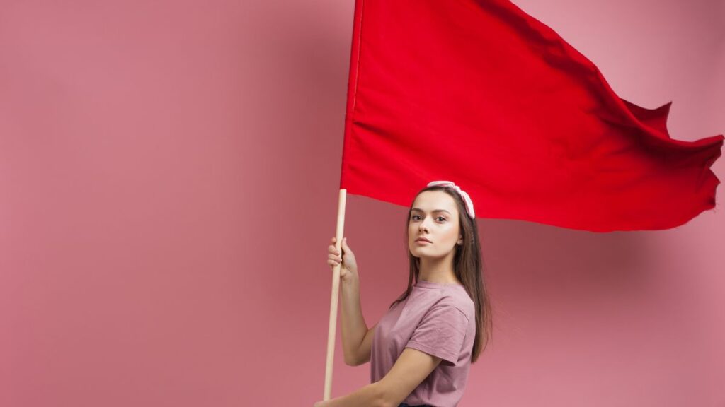 woman flying a red flag