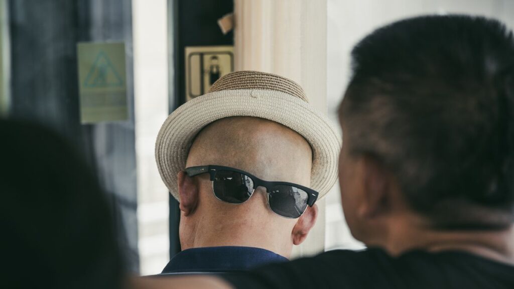 Man Wearing Sunglasses backwards 