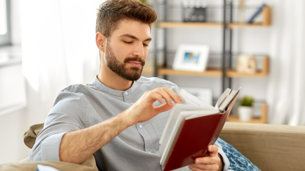 Man reading on couch