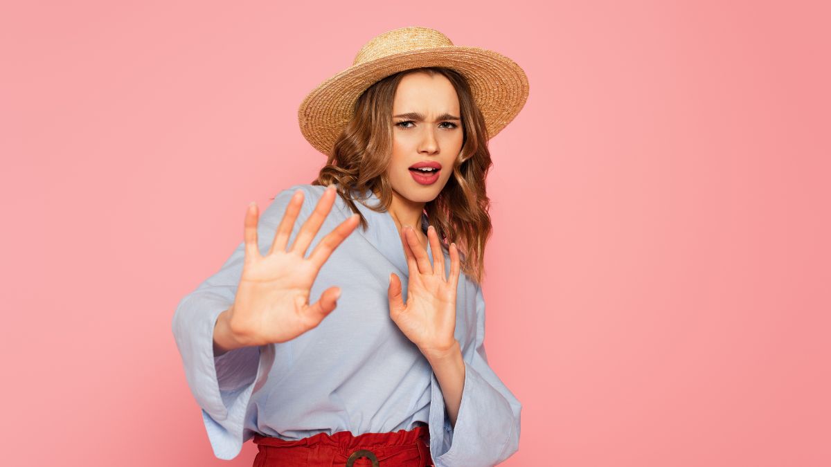 woman looking upset showing no with hands up