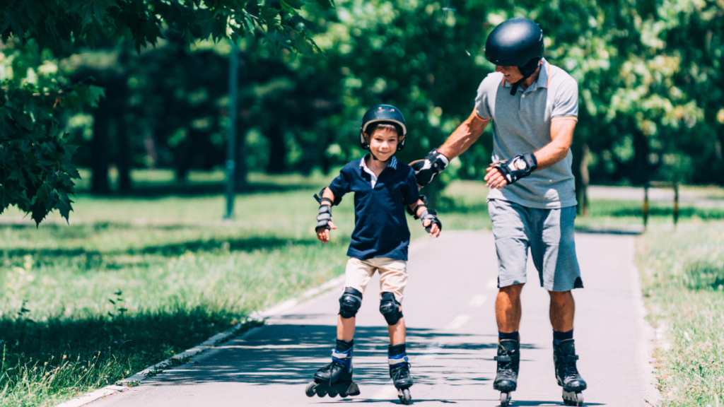 man roller blading with son