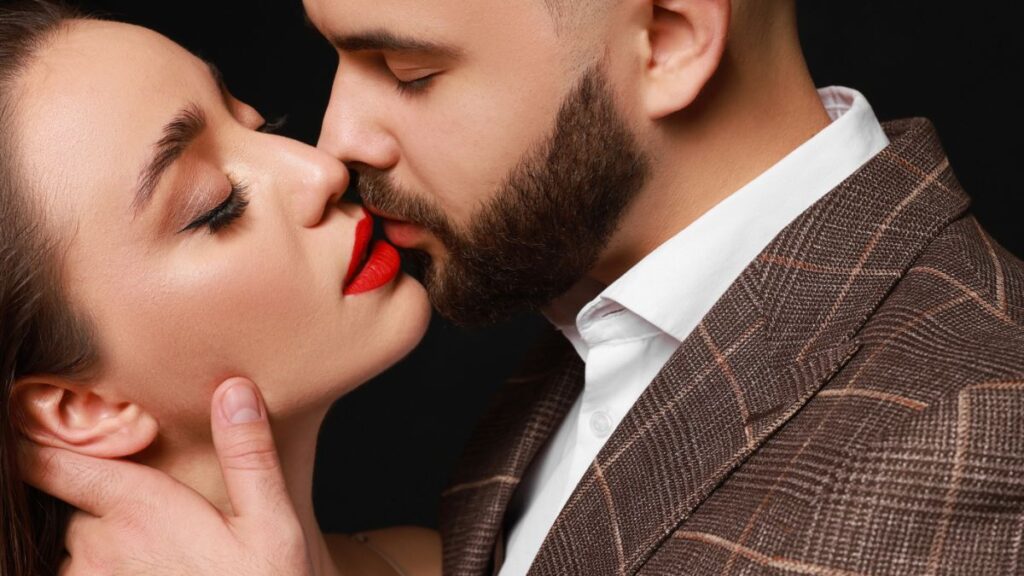 man and woman kissing, red lips